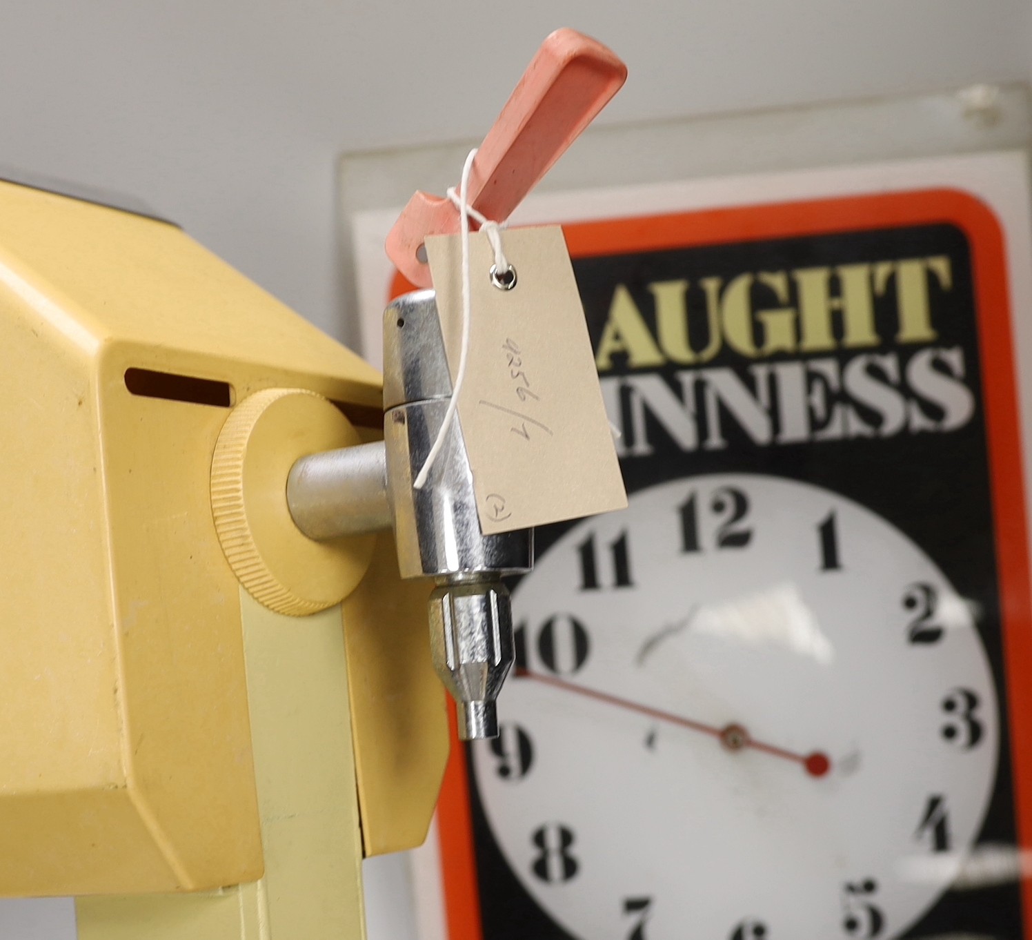 A rare Guinness bar dispenser and a Guinness wall clock
